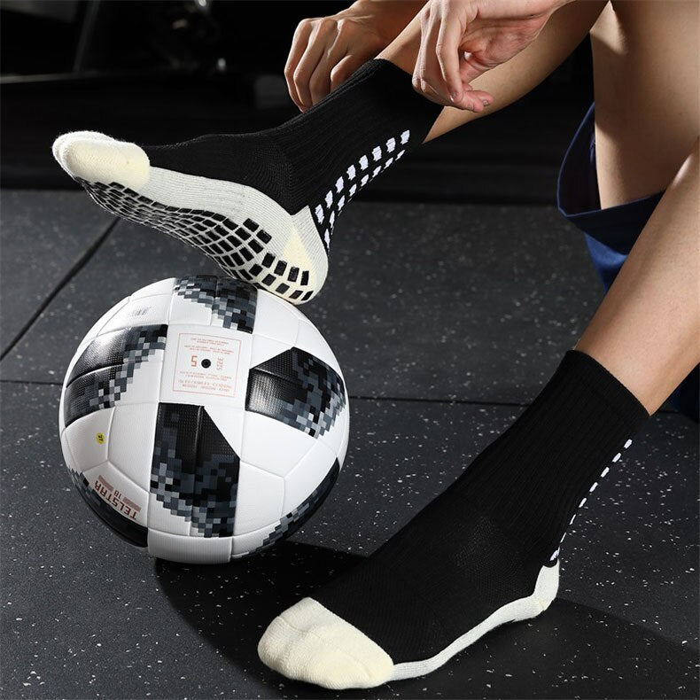 Mid-calf anti-slip grip socks with traction pads for soccer and basketball