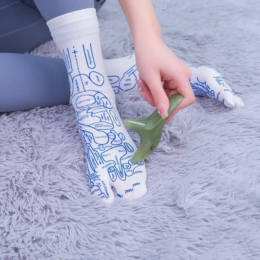 Reflexology acupressure socks with foot pressure point map