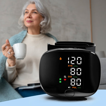 Rechargeable digital wrist blood pressure monitor with backlit LCD