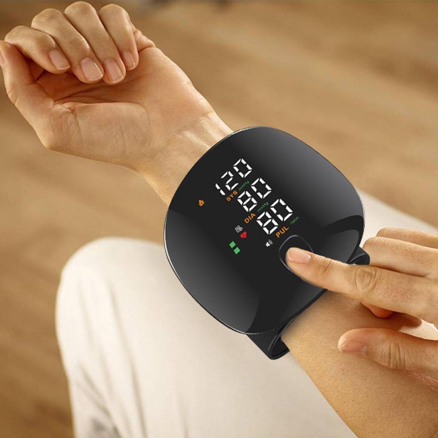 Rechargeable digital wrist blood pressure monitor with backlit LCD