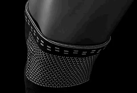 Adjustable knee brace with twin lateral stabilizers and patellar wrap
